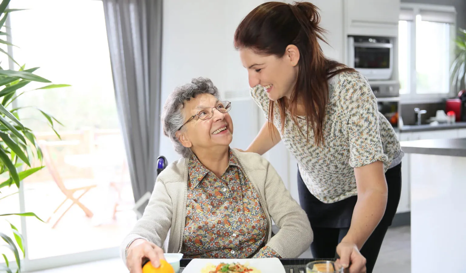 caregiver and elderly woman