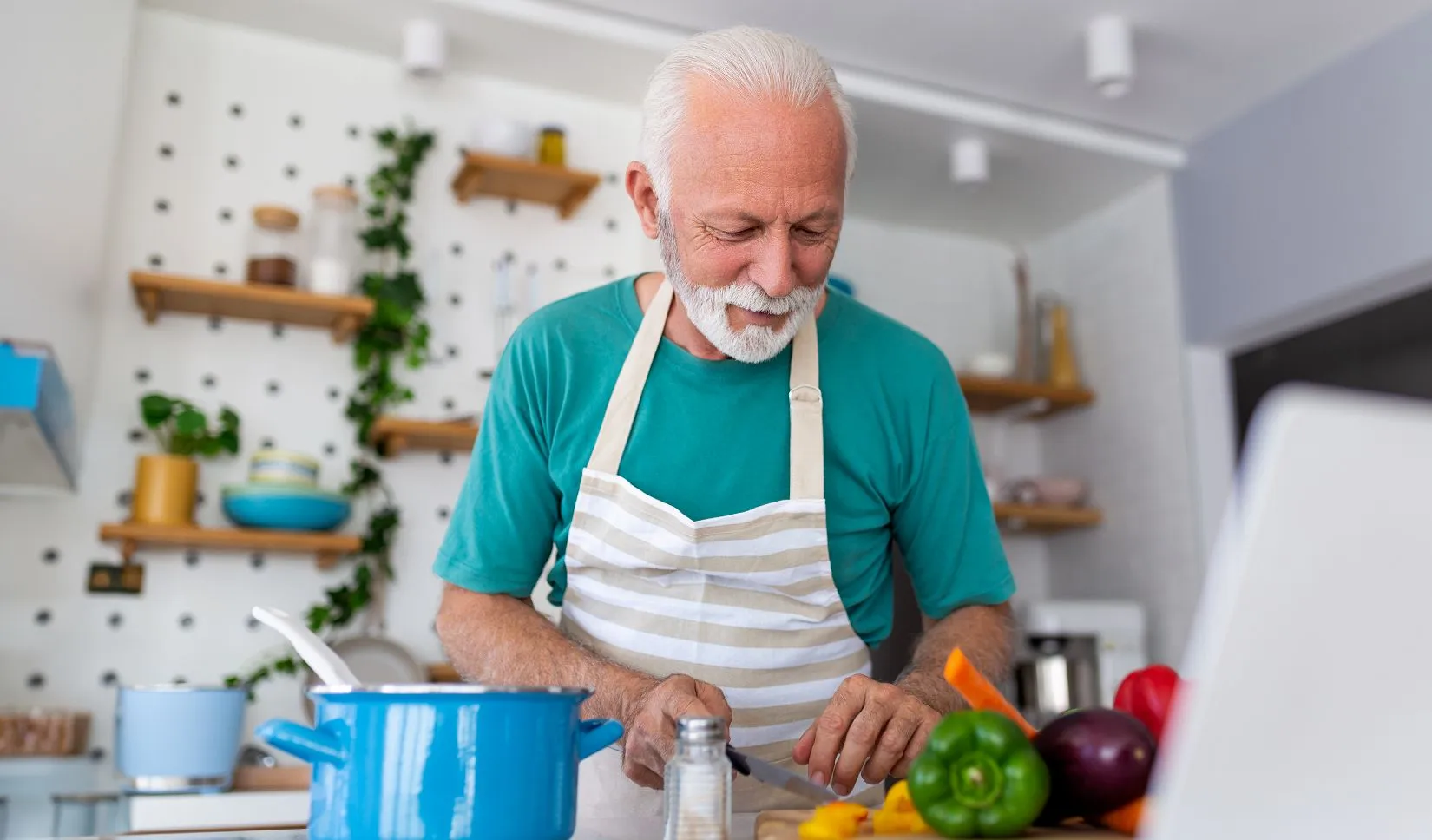 elderly man cooking
