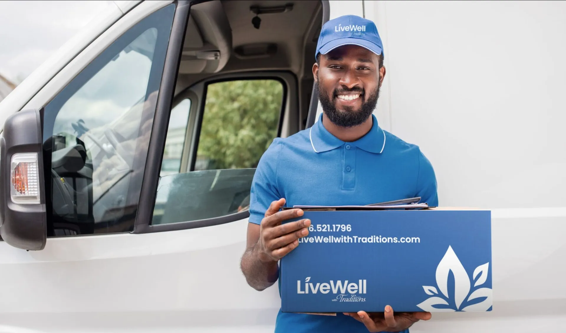 LiveWell with Traditions delivery driver smiling in front of white van