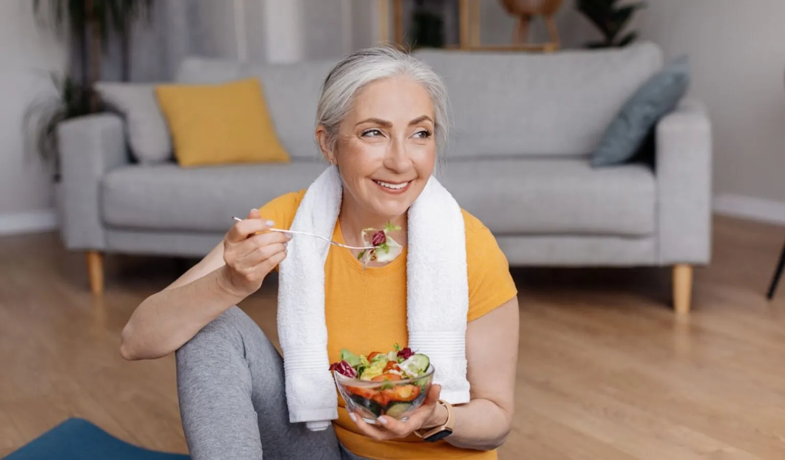 a woman eating a salad