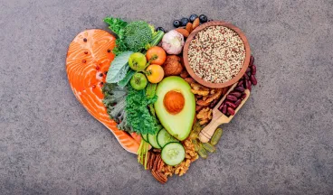 healthy fats and vegetables arranged like a heart