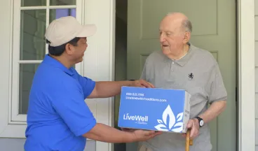 elderly man receives live well package