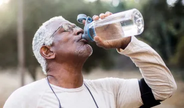 man drinking water