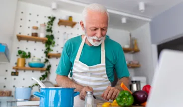 elderly man cooking