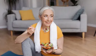 a woman eating a salad