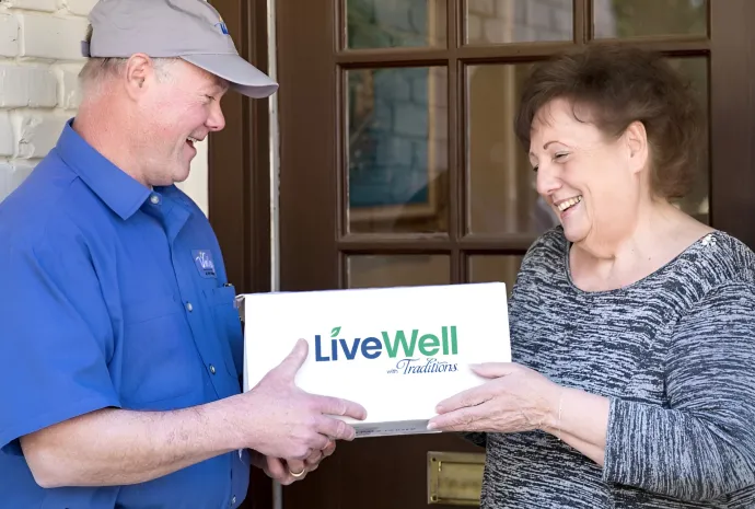 woman getting livewell delivery package