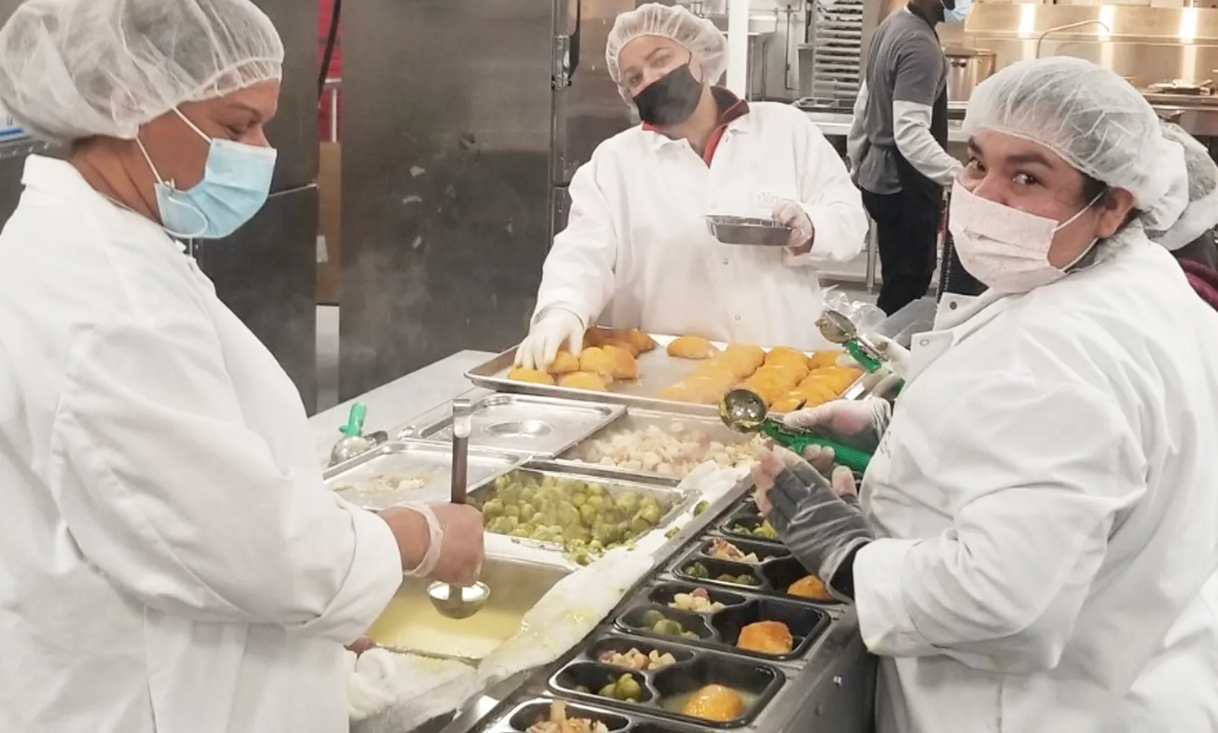 three chefs preparing food