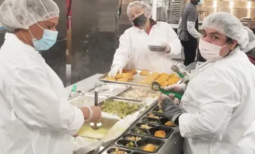 three chefs preparing food