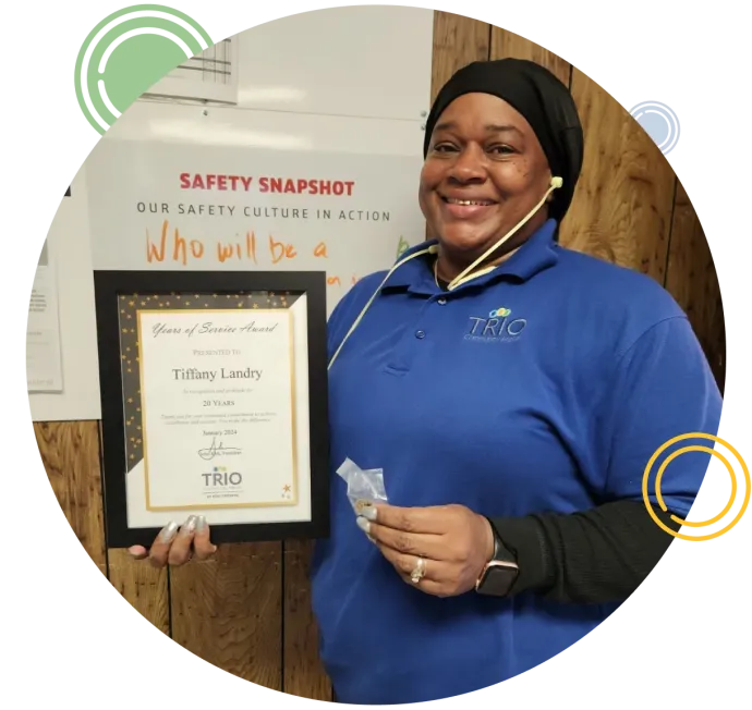 a woman holding a certificate
