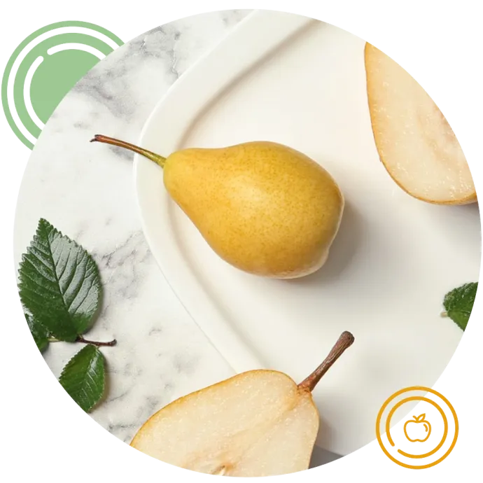 Pears on a white plate and marble counter