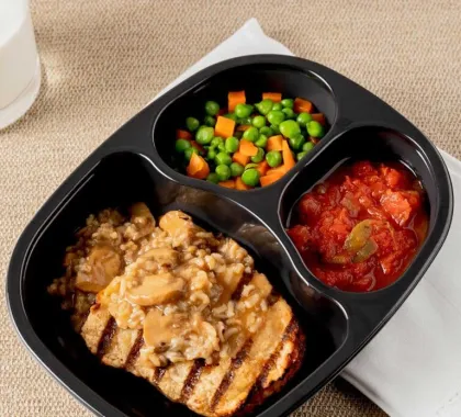 Chicken with mushroom rice, stewed tomatoes and mixed vegetables