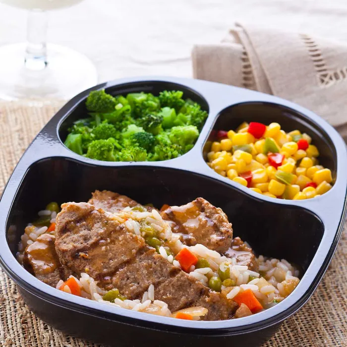 NY Beef Strip Patty with Orange Rice & Vegetables with Corn with Peppers & Broccoli Florets