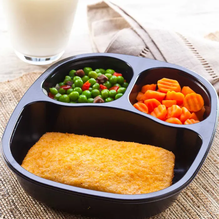 Breaded pollock with carrot and peas