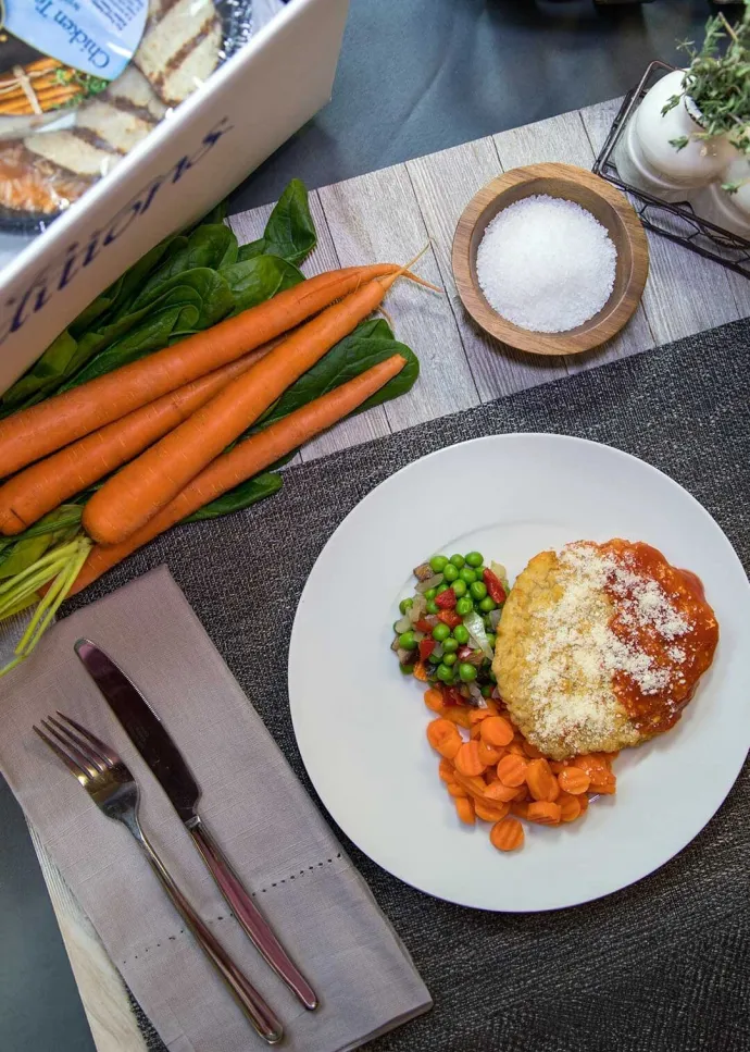 Traditions Meals Chicken Parmesan with carrots and peas with onions and peppers