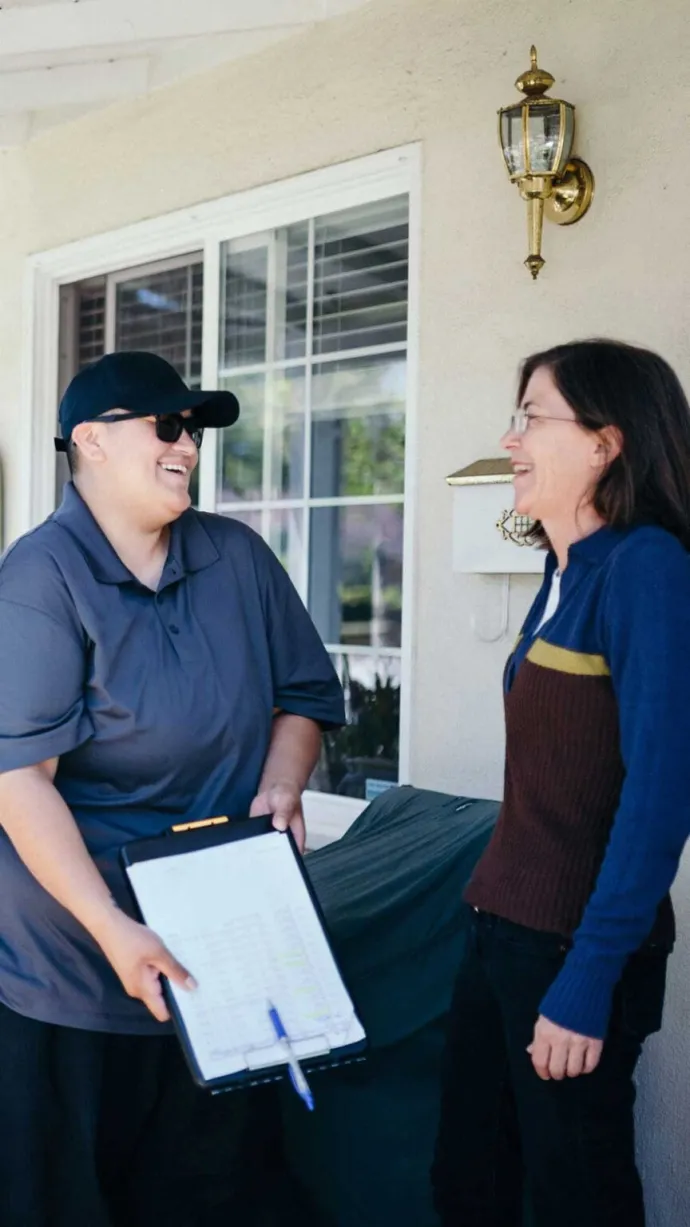 Traditions Meal driver having a happy conversation with customer