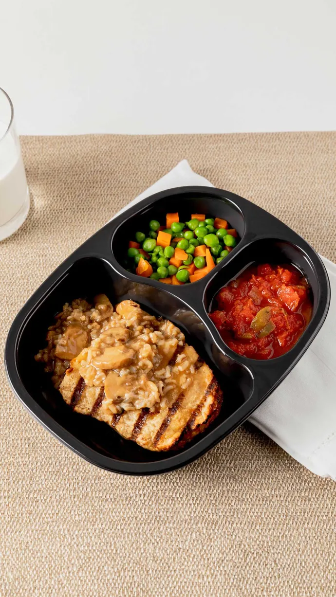 Traditions Frozen Meal tray of Chicken with Mushroom Rice, vegetable blend and eggplant