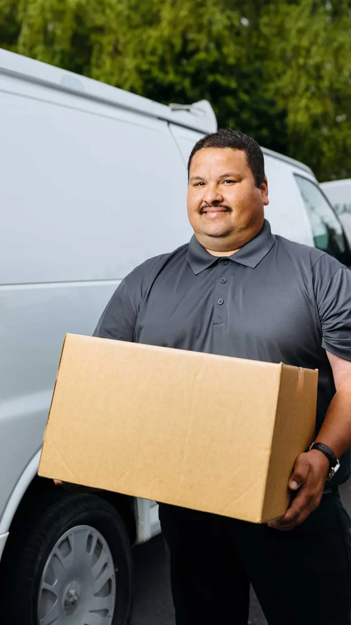 Driver delivering box of Traditions Meals